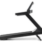 Black Freemotion t8.9b treadmill with angled running deck, vertical handlebar, and control panel on white background