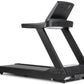 Black motorized treadmill with digital display console, handrails, and rolling base on white background