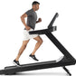 Man running on black and white Freemotion t8.9b treadmill wearing gray t-shirt and white shorts