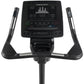 Black Freemotion upright exercise bike with digital console displaying metrics, dual handlebar grips, and pedals on white bac