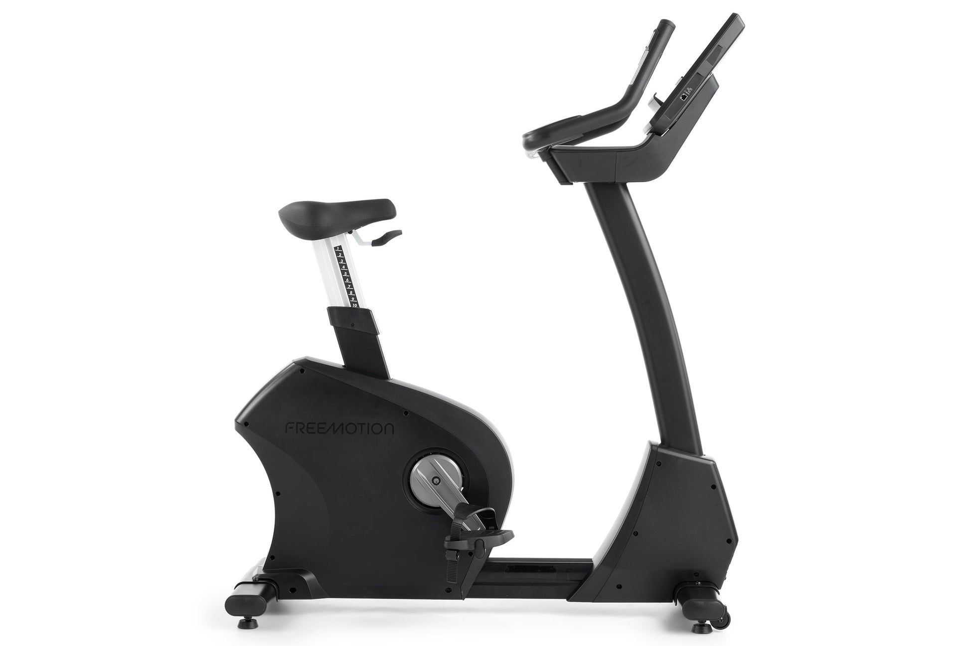 Freemotion U10.9B black upright exercise bike with padded seat, dual handlebars, and digital console on white background