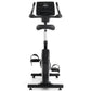 Black upright exercise bike with digital console display, dual handles, padded seat, and foot pedals on white background