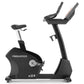 Freemotion u22.9 black upright exercise bike with white seat post and dual handlebar grips on white background