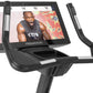 Freemotion u22.9 upright exercise bike with black frame, silver accents, digital display screen, and dual handlebars