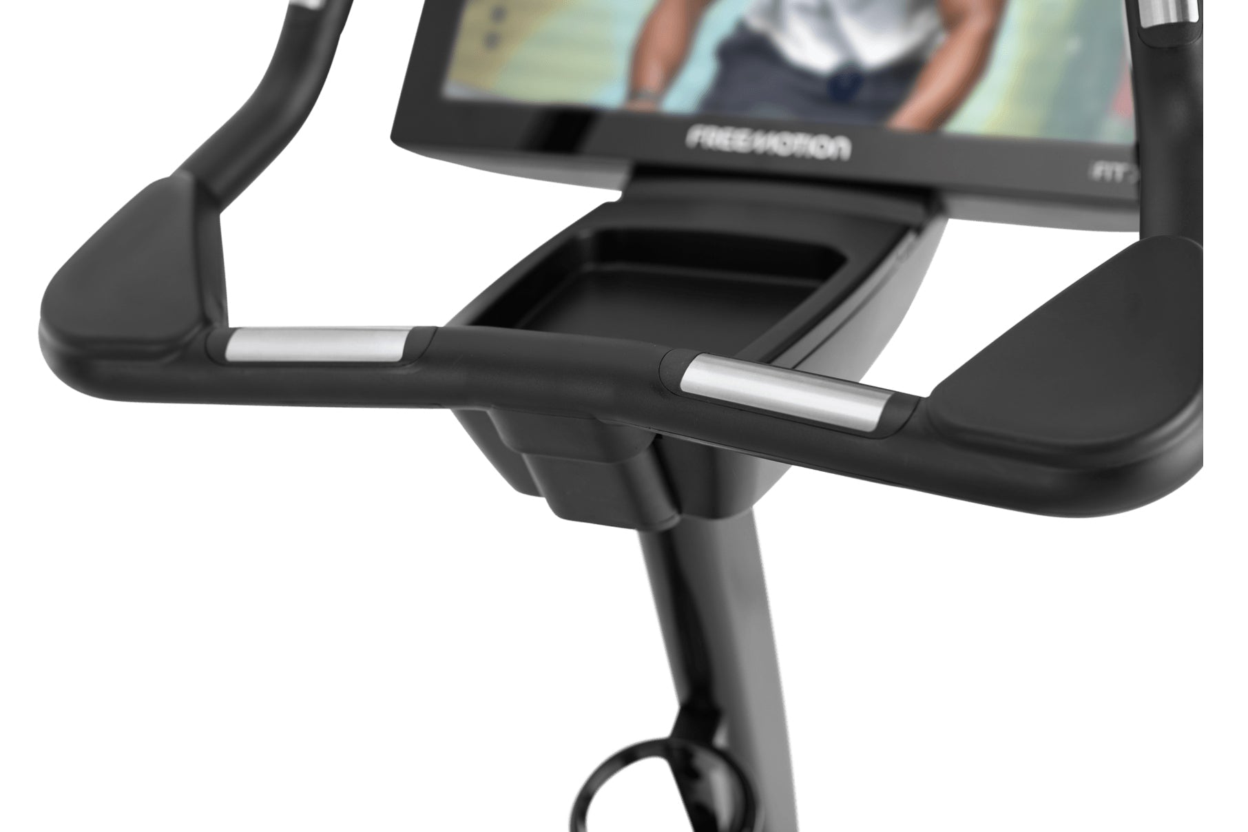 Black upright exercise bike with curved handles, digital display screen, and silver accent details on handlebars