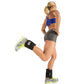 Woman jogging in motion wearing blue sports bra, gray shorts, and black adjustable ankle weights with neon yellow accents