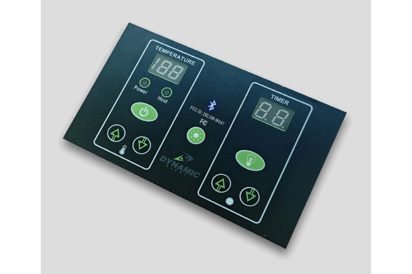 Dark teal sauna control panel with green illuminated buttons, digital temperature and timer displays, power and heat controls