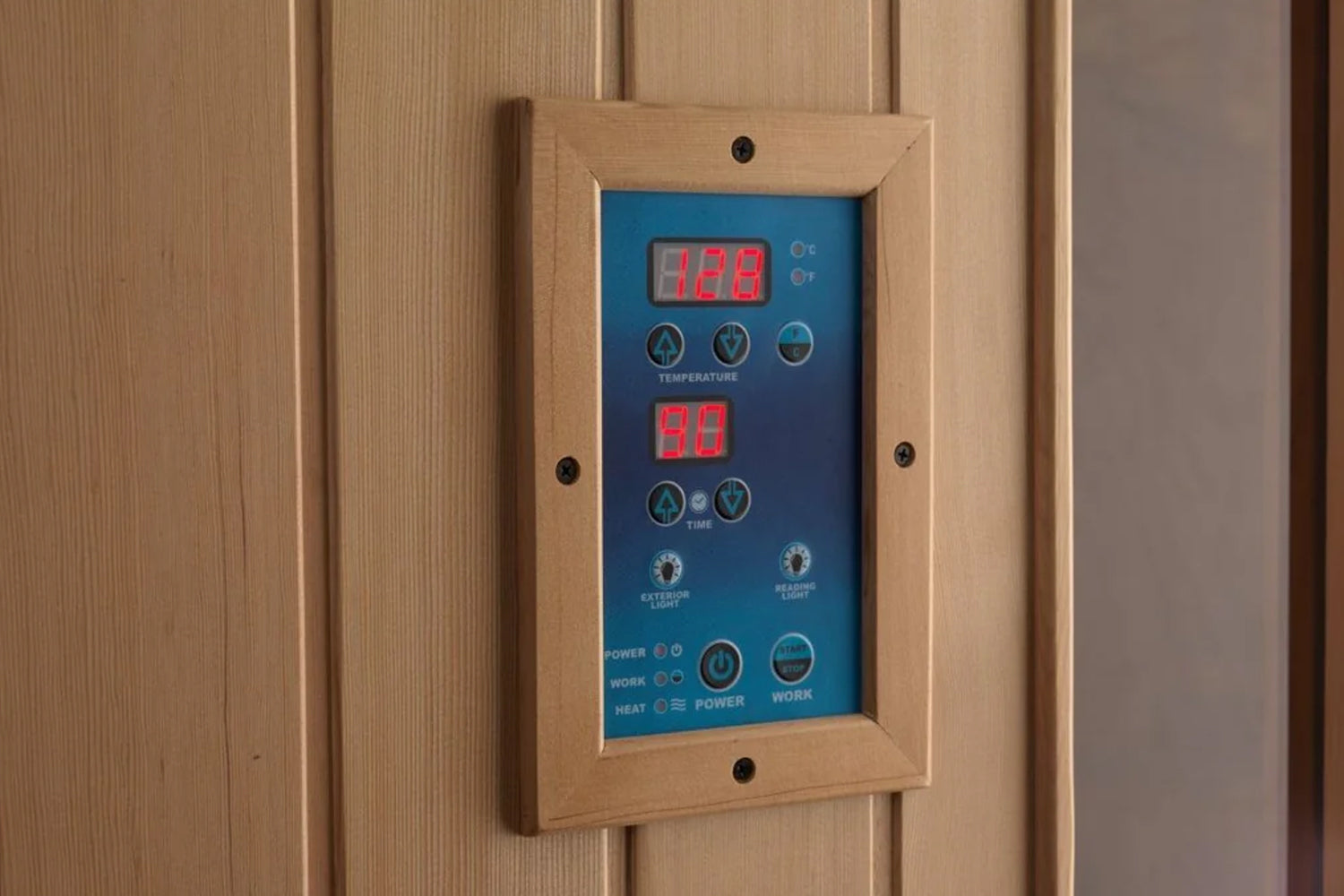 Wood-framed sauna control panel with blue faceplate, red LED temperature display showing 128 degrees and timer display showin