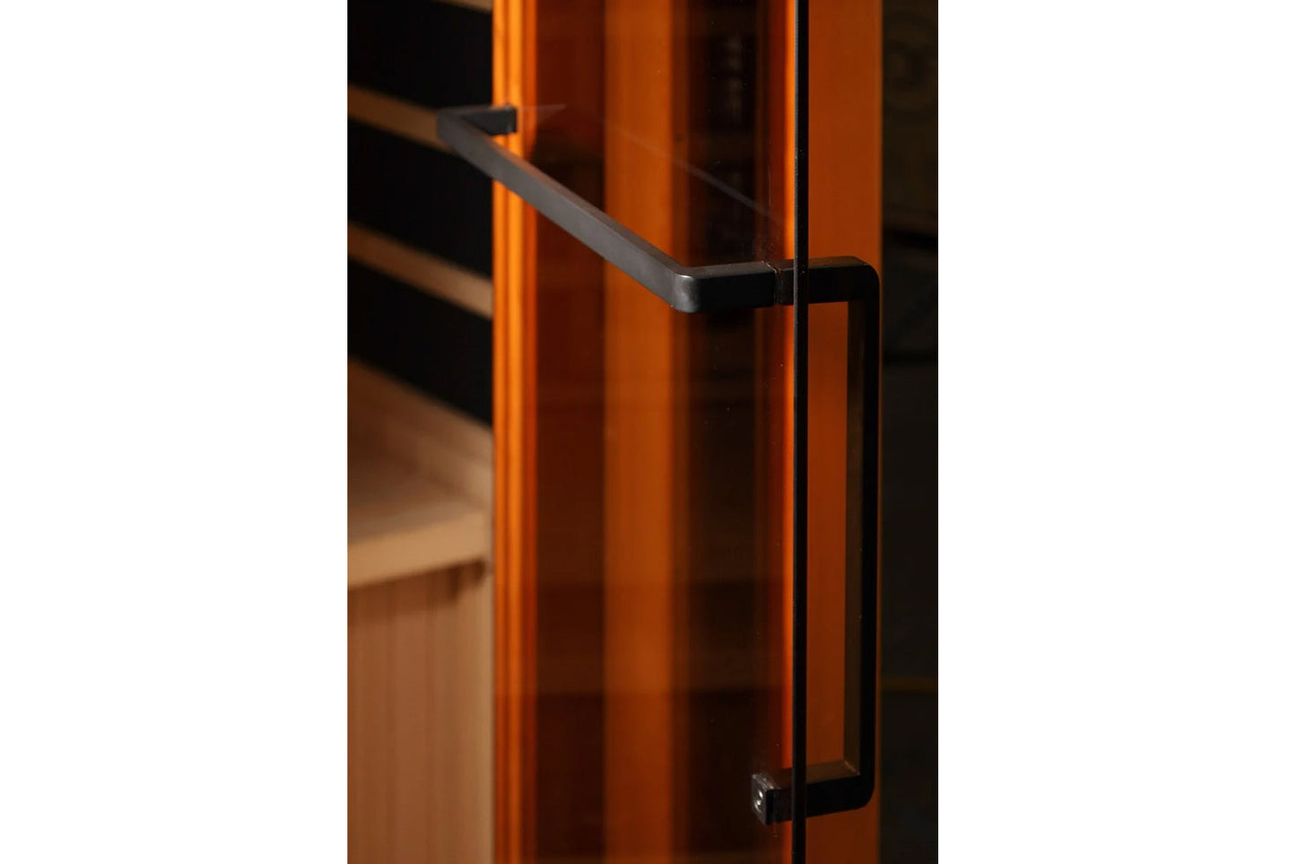 Golden Designs 2-3 person corner infrared sauna with orange wood exterior and black metal handle detail