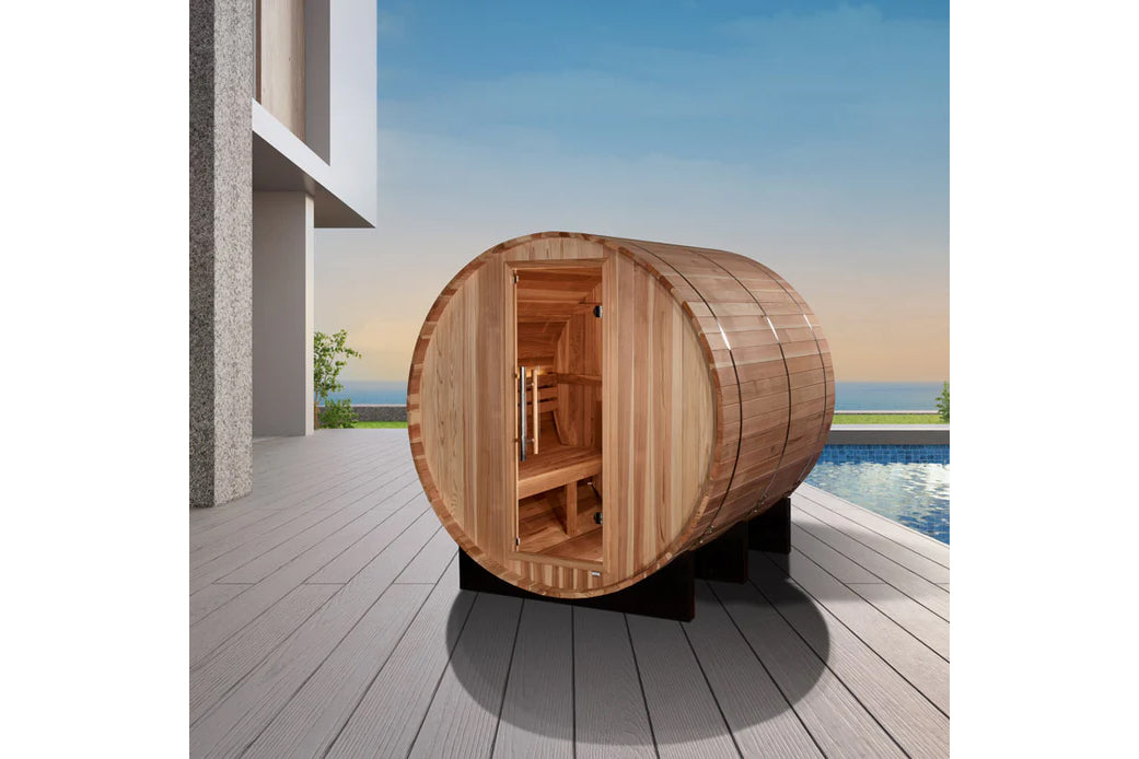 Golden Designs Arosa barrel sauna with natural wood construction, open door showing interior benches, positioned on outdoor d