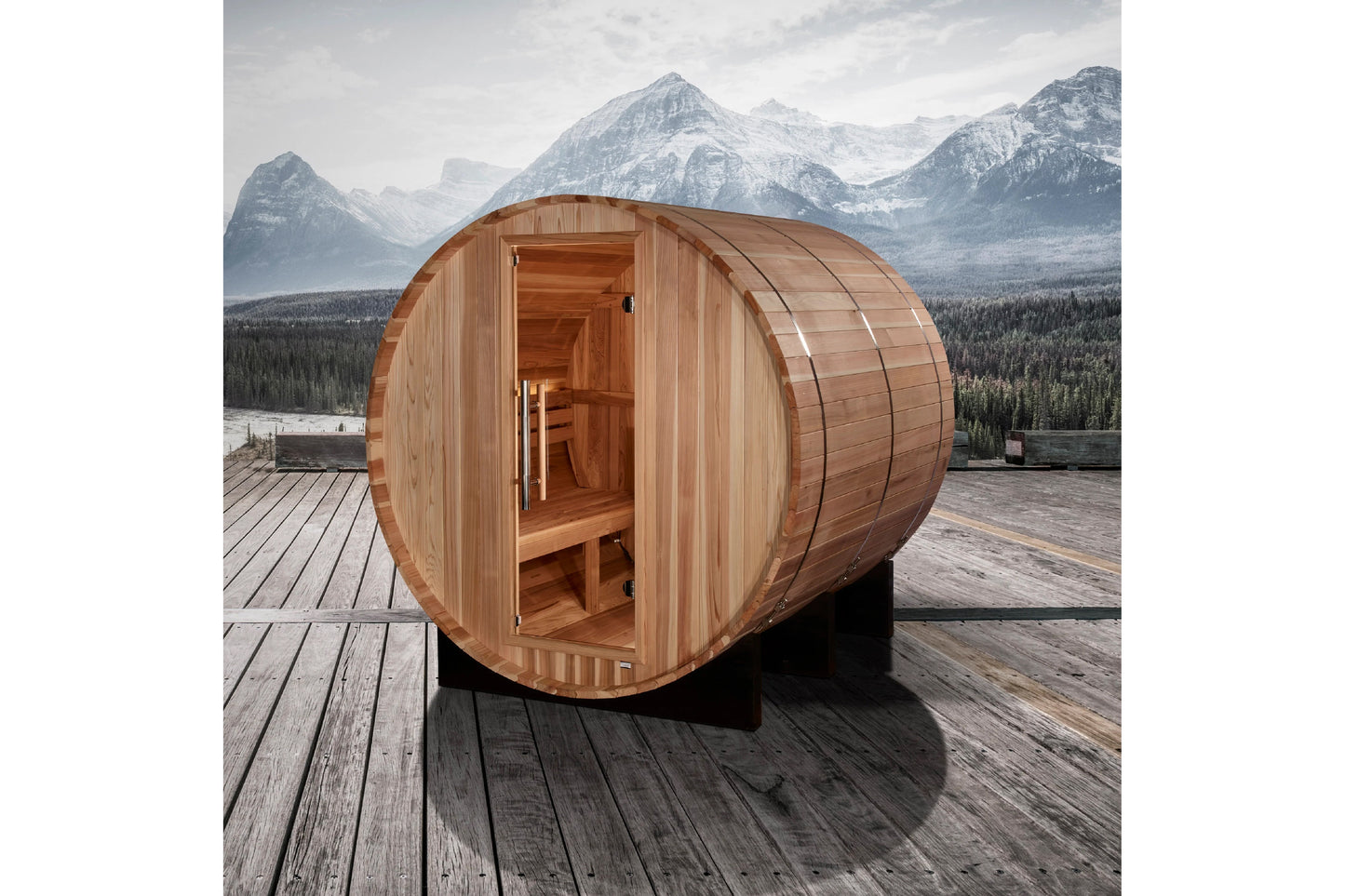 Golden Designs Arosa barrel sauna in light wood with open door showing interior benches, positioned on wooden deck with snow-
