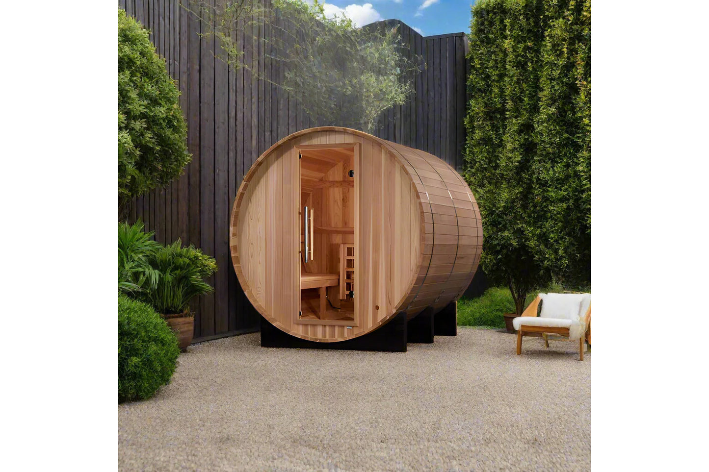 Golden Designs Arosa barrel sauna with light wood exterior and open door showing interior benches, positioned in modern backy
