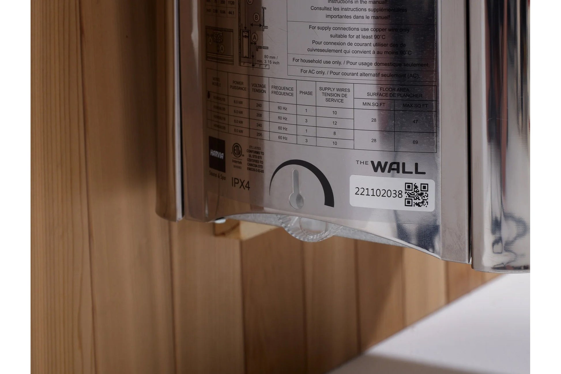The Wall sauna instruction label showing technical specifications, frequency, voltage, and QR code on white background
