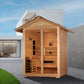 Golden Designs Carinthia 3-person hybrid sauna with natural cedar wood exterior, gabled roof, and glass door in backyard sett