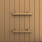 Natural wood sauna interior with vertical paneling and two wooden shelves mounted on the wall