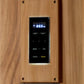 Digital sauna control panel with blue LED display showing temperature, mounted on light wood exterior wall