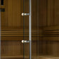 Golden Designs Copenhagen sauna glass door with chrome handles and pearl knobs, showing wood interior with benches visible th