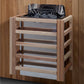Natural wood sauna with open top lid containing black interior components and folded towels, multiple horizontal wooden shelv