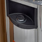 Black and stainless steel sauna door with digital temperature control dial and power button, partial view of sauna exterior