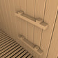 Interior view of sauna with light wood paneling walls, wooden slat floor, and two horizontal wooden handles mounted on wall