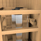 Light wood sauna with glass door and benches, viewed from front interior angle showing seating layout