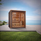 Golden Designs Drammen 3-person traditional sauna with cedar wood interior, glass front doors, and bench seating on coastal p