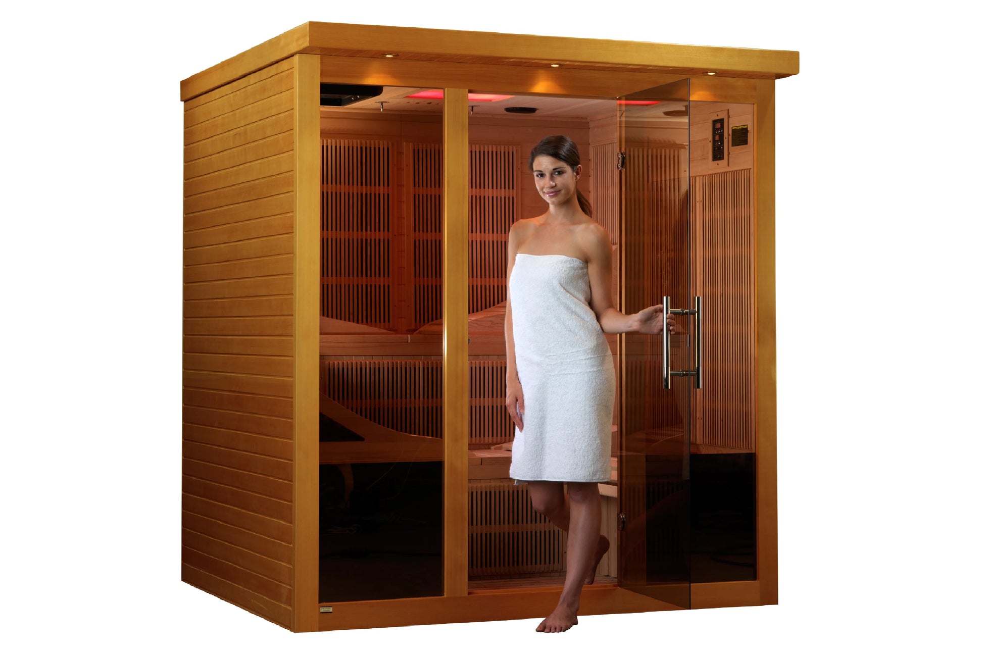 Cedar far infrared sauna cabin with glass door and front panels, woman in white towel standing in doorway, interior featuring