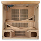 Natural wood far infrared sauna with three benches, slatted heater panels, and two lower bench compartments, viewed from fron