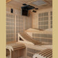 Interior view of light wood sauna cabin with tiered seating, vertical wood paneling walls, mounted black ventilation unit, an