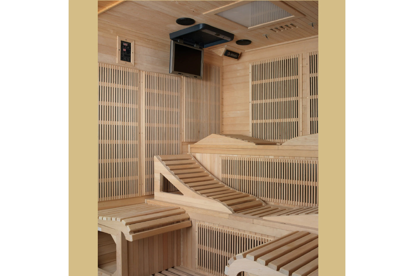 Interior view of light wood sauna cabin with tiered seating, vertical wood paneling walls, mounted black ventilation unit, an