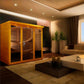 Golden wood framed sauna cabin with glass doors in modern living room setting, featuring interior wooden bench seating and in