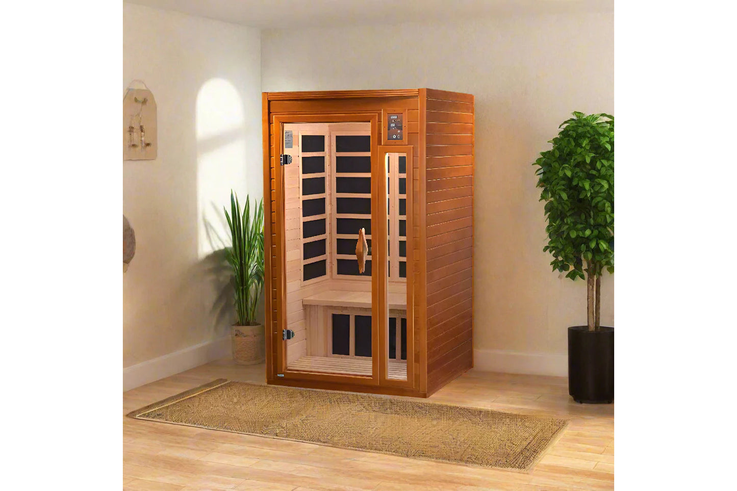 Wood infrared sauna cabin with glass front door and black heating panels inside, displayed in home setting with potted plants
