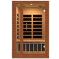 Two-person infrared sauna with cedarwood frame, black heating panels, and glass door, featuring interior lighting and bench s