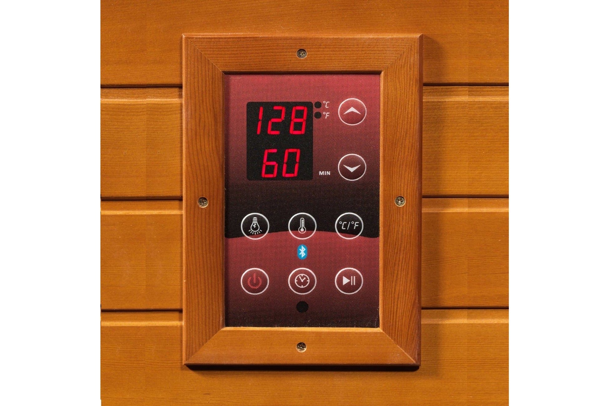 Sauna control panel with wooden frame mounted on cedar wall, displaying digital temperature of 128 degrees and 60 minutes wit
