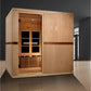 Light wood infrared sauna cabin with glass front door, interior bench seating, LED ceiling lights, and dark wood accent trim,