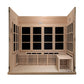 Light wood infrared sauna with glass front doors, bench seating, and interior black glass panels, front-facing view on white 