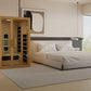 Golden Designs Gracia sauna with light wood construction and glass doors in modern bedroom setting with bed