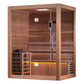 Golden Designs Hanko Edition cedar sauna with glass door, bench seating, control panel, and ambient yellow lighting on white 