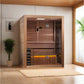 Golden Designs Hanko Edition 2-3 person indoor traditional sauna with cedar wood construction and glass doors in spa setting
