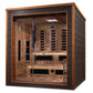 Golden Designs Karlstad infrared sauna with cedar wood interior, glass front doors, and full spectrum heater panels, on white
