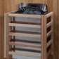 Natural wood sauna with open top containing black sauna heater and stones, four horizontal shelves, gray interior, on wooden 