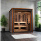 Golden Designs Karlstad six-person sauna with cedar interior, glass doors, and bronze frame in modern spa setting