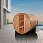 Golden Designs Klosters barrel sauna with cedar wood construction, open door showing wooden benches, positioned on modern dec