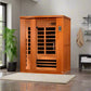 Golden Designs Lugano 3-person infrared sauna in orange wood with glass door and control panel, on cream mat in modern bathro
