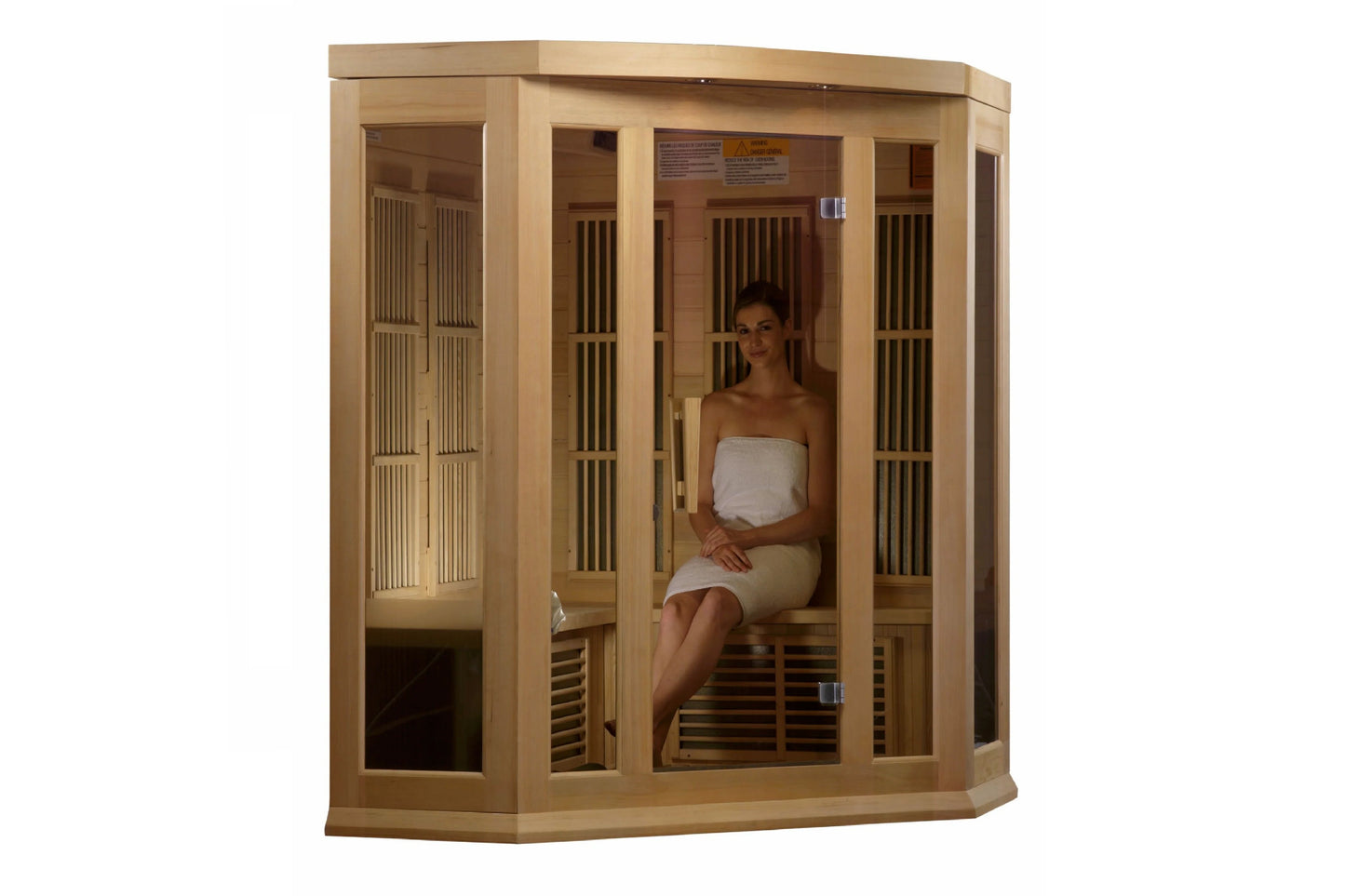 Natural wood corner sauna with glass and slatted cedar panels, woman sitting inside wearing white towel on wooden bench