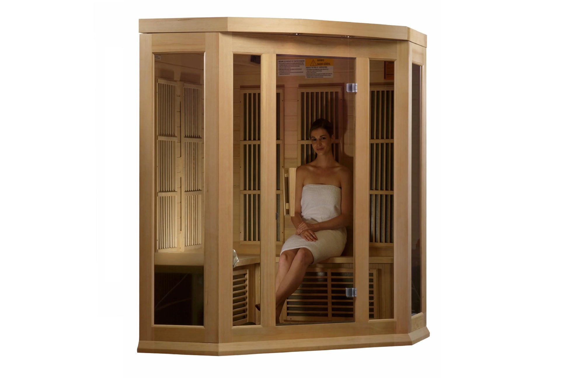 Natural wood corner sauna with glass and slatted cedar panels, woman sitting inside wearing white towel on wooden bench