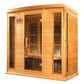 Natural cedar wood infrared sauna with glass front doors, digital control panel, and black carbon heaters visible inside on w