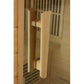Natural wood cylindrical door handle on light wood sauna door frame
