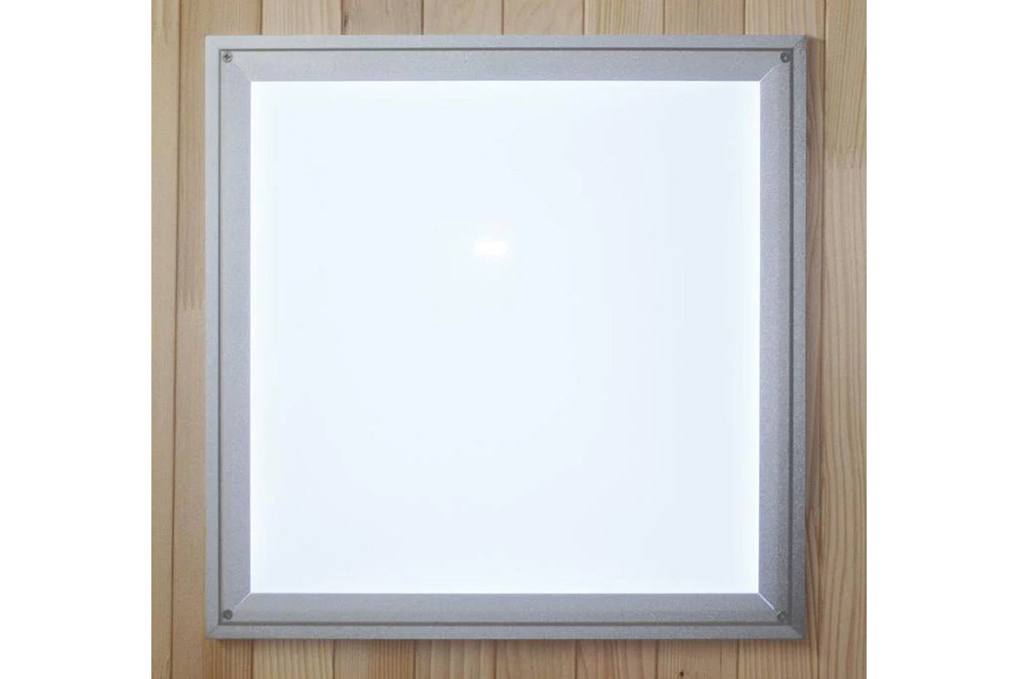 Silver-framed square mirror with white center and corner mounting hardware on wooden background