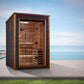 Golden Designs Narvik 2-person outdoor sauna with dark exterior, cedar wood interior, glass door, and benches on patio by oce